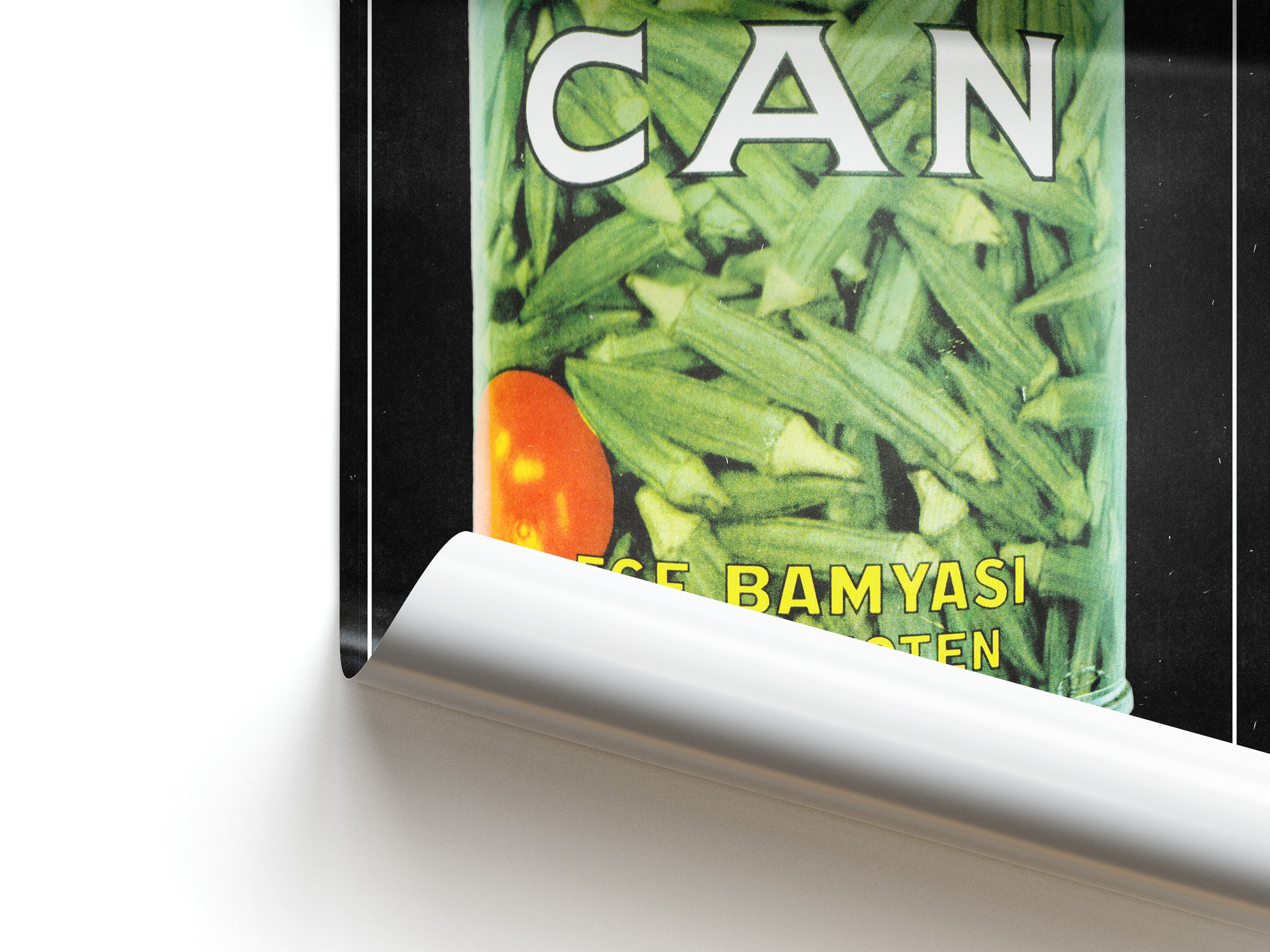 Close-up of a poster of a can with okra and a tomato.