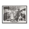 Black and white poster of 'Down by Law' with three people behind bars, featuring the film's title and director's name.