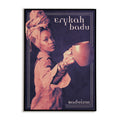 Poster of Erykah Badu holding a cup with 'Erykah Badu' and 'Baduizm' text.