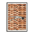 Framed artwork of a nude person laying face down over a patterned background of womens legs with magazine clippings that read 'Femme and Fortune?'