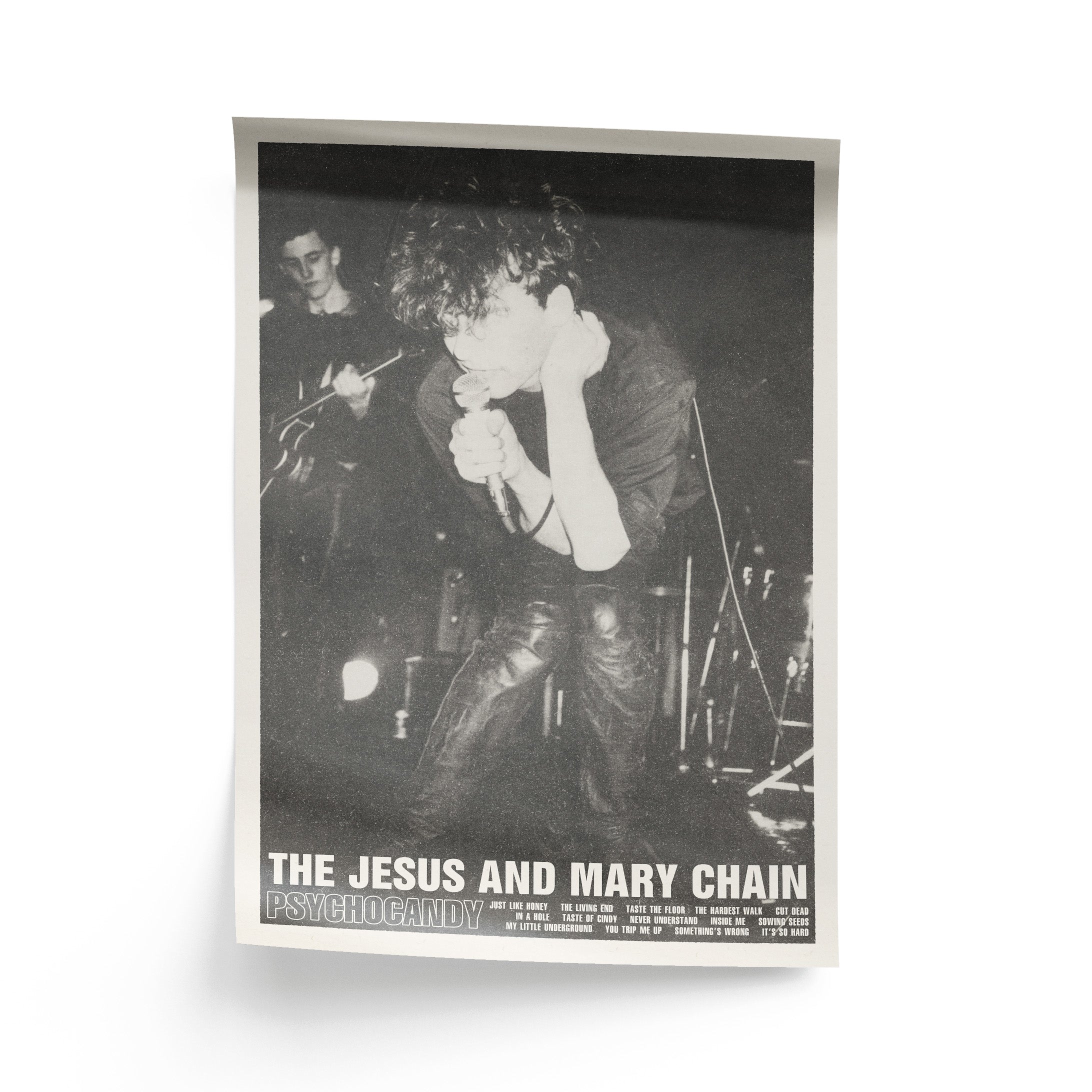 Poster of The Jesus and Mary Chain with a musician playing guitar and another playing keyboard.