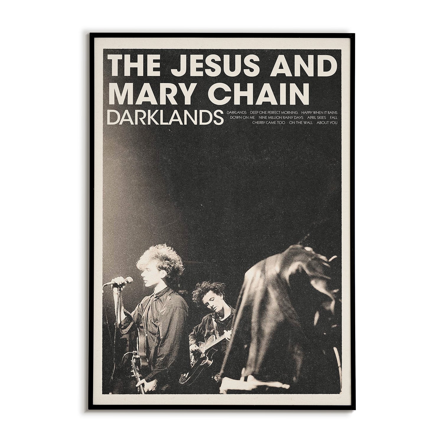 Poster of The Jesus and Mary Chain with band members on stage and 'Darklands' text.