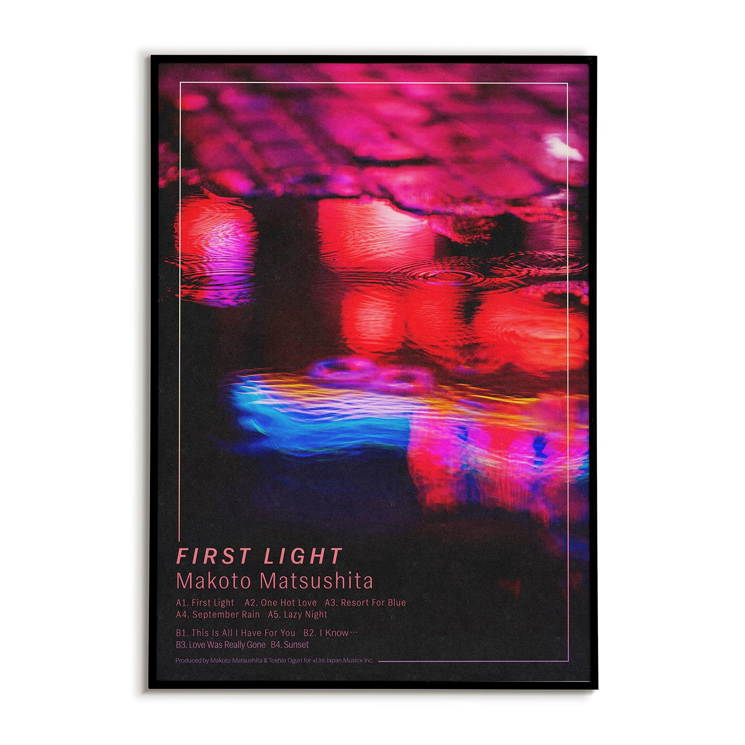 Framed poster with abstract colorful design depicting a neon puddle in a city street and text saying "Makoto Matsushita First Light". The album's full track list is also included at the bottom of the print.