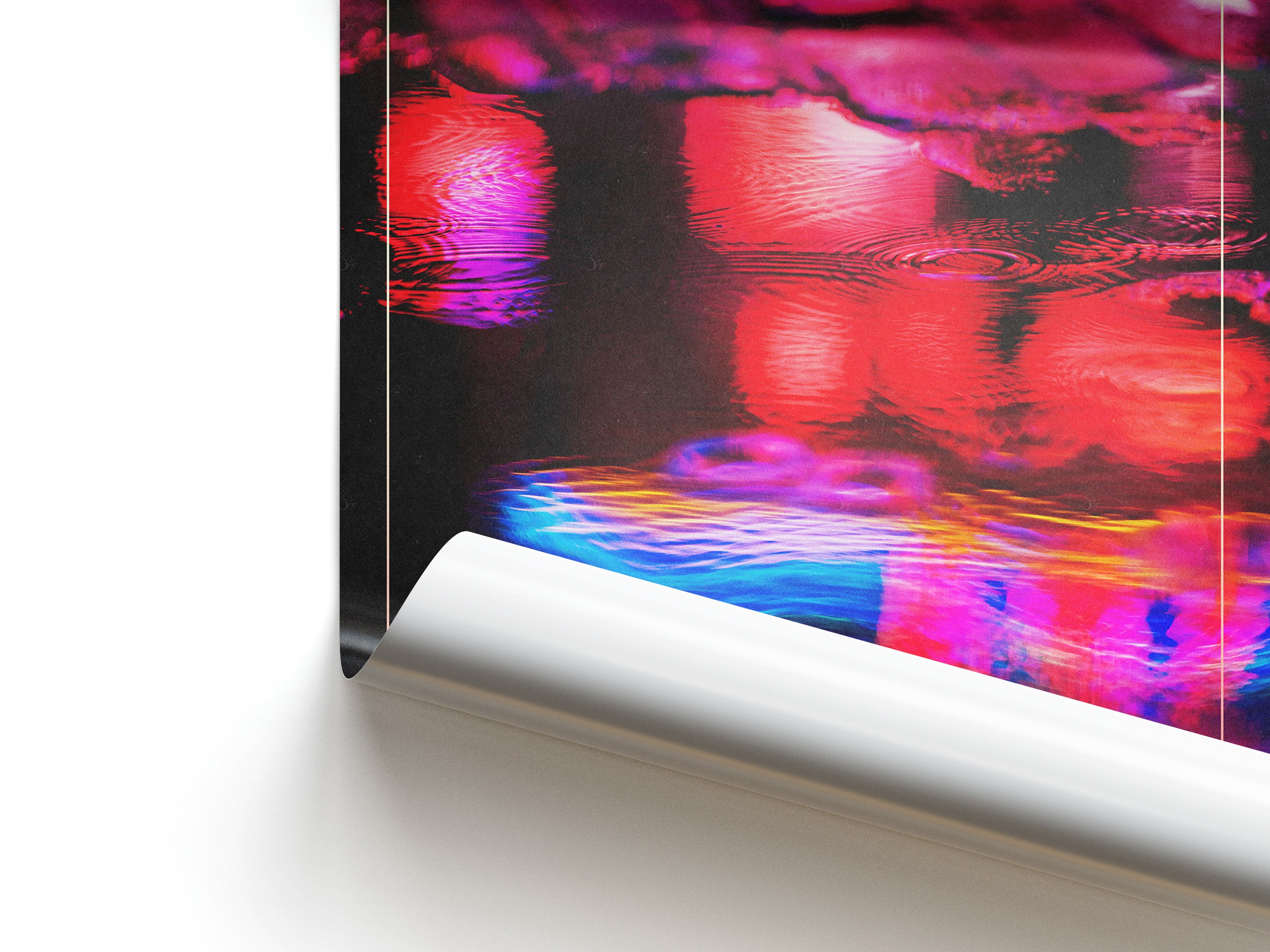 Close-up of a colorful abstract painting with vibrant red, blue, and purple hues on a white surface.