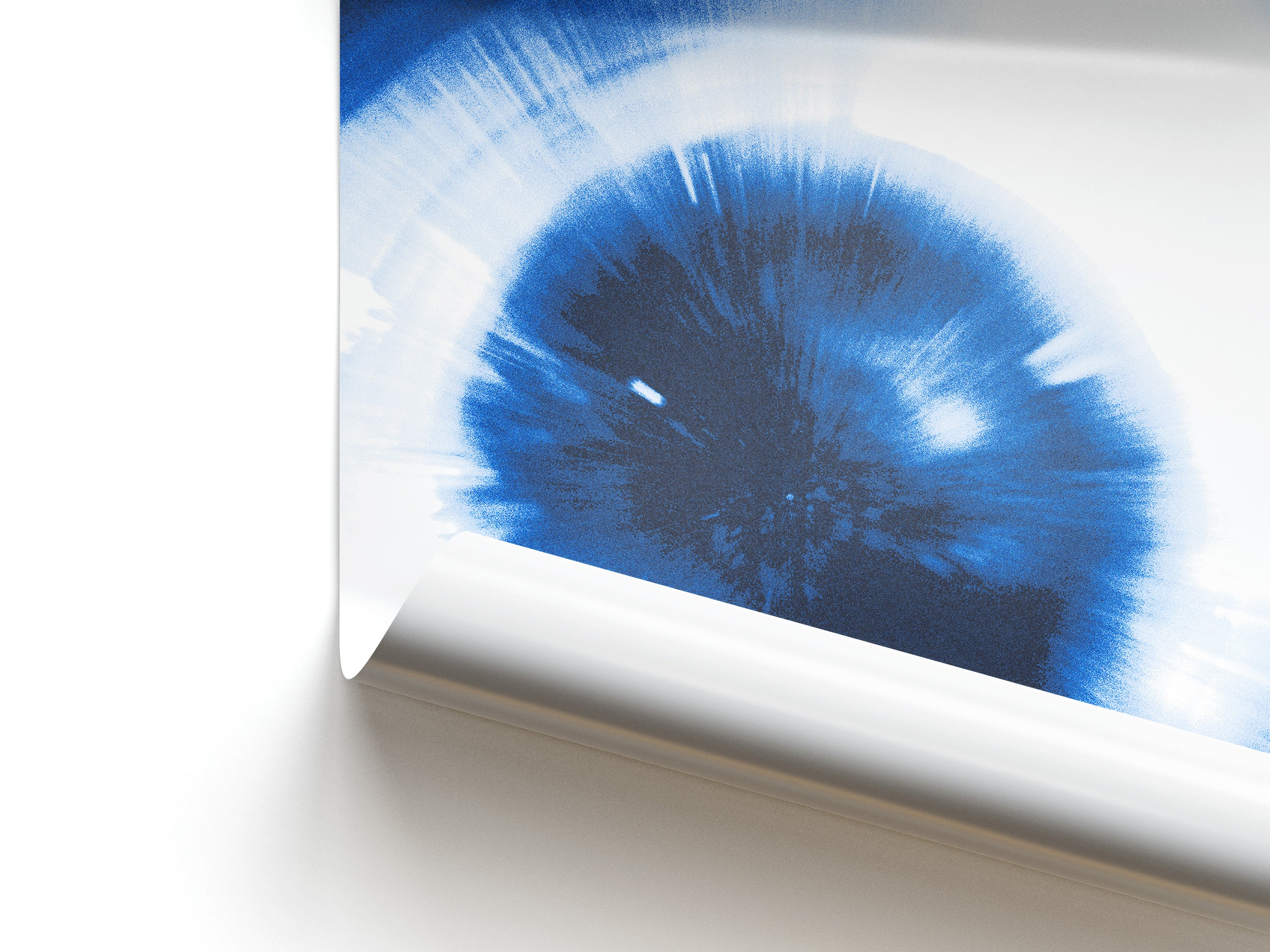Close-up of a blue and white abstract pattern on a white background