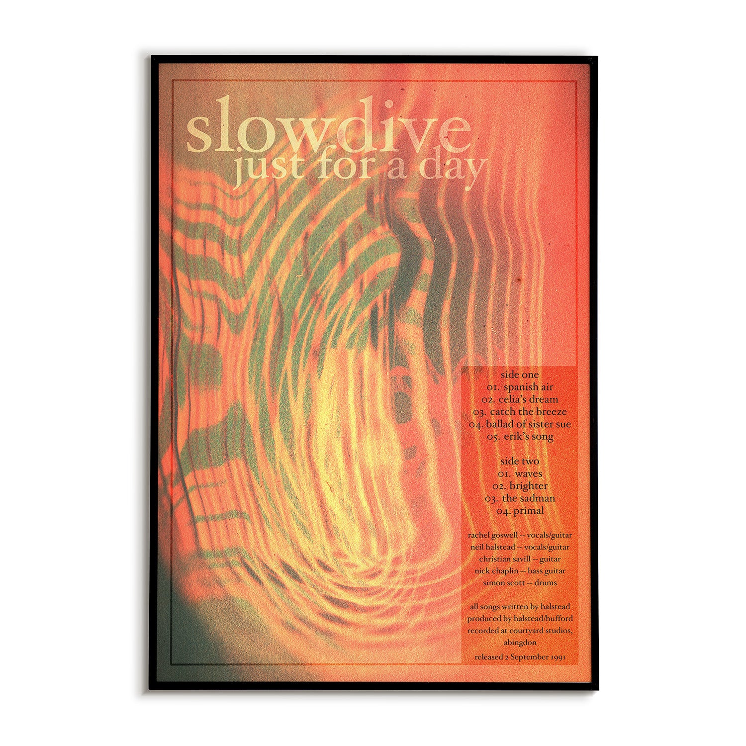 Album cover with 'slowdive' and 'just for a day' text on an abstract orange and green background.