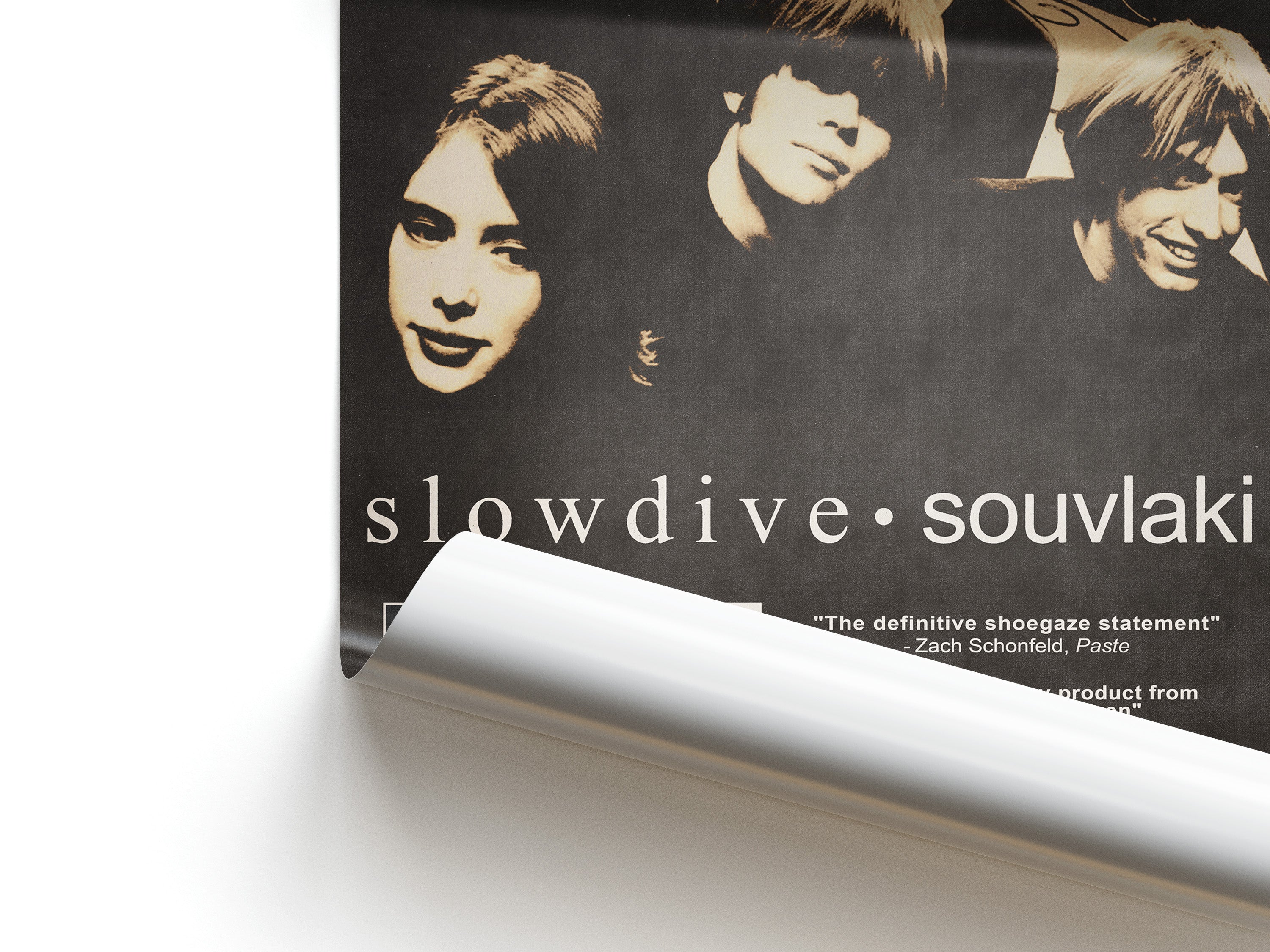 Album cover of 'souvlaki' by Slowdive with band members' faces on a black background.