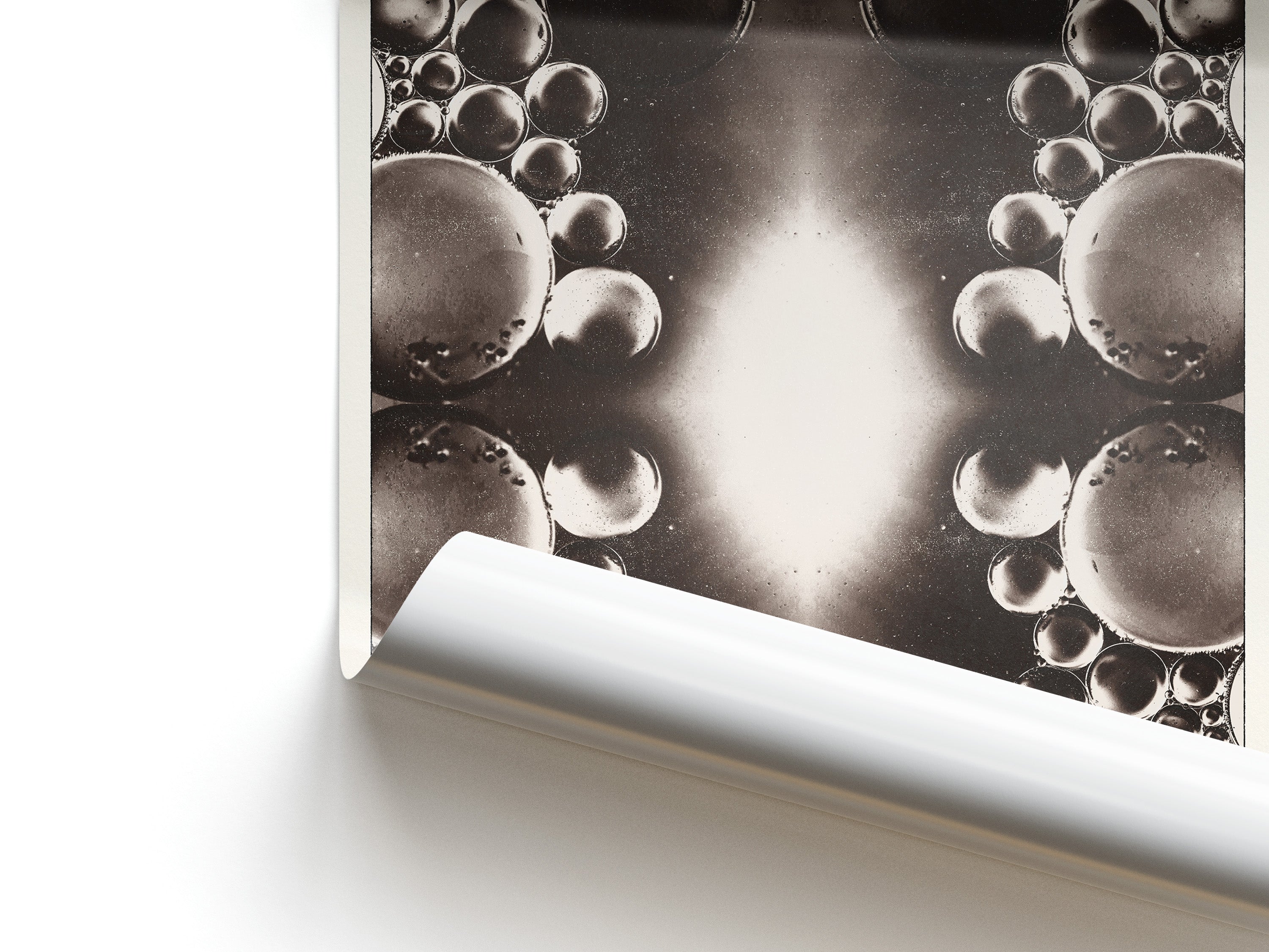 Close-up of a black and white bubble pattern on a textured surface