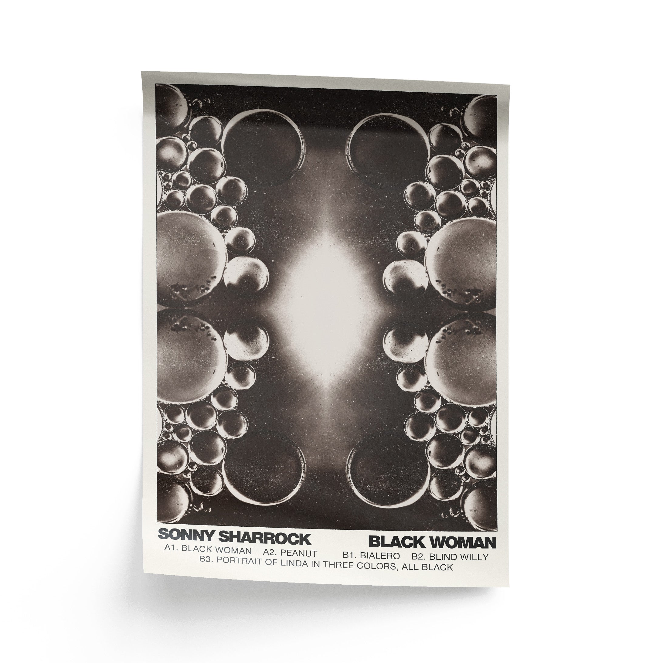 Poster with a surreal kaleidoscopic image of black and brown bubbles. Text at the bottom read "Sonny Sharrock Black Woman" alongside the album's tracklist.
