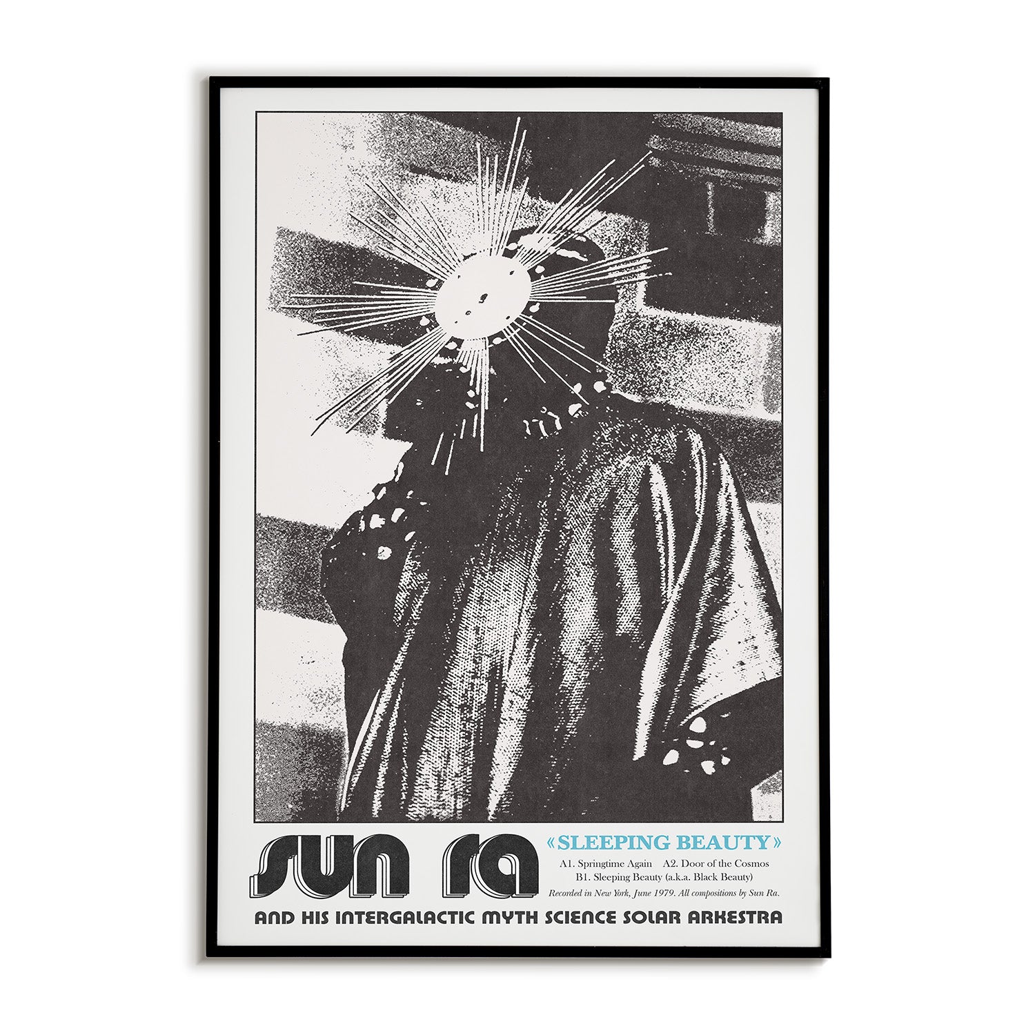 Framed poster of Sun Ra with a stylized face and text at the bottom.