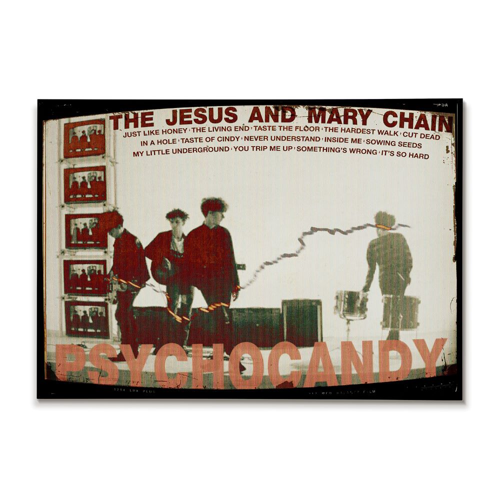 Album cover for 'Psychocandy' by The Jesus and Mary Chain with band members and text.