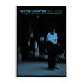 Retro jazz poster featuring bold typography and a picture of Wayne Shorter with a spiral blur effect.